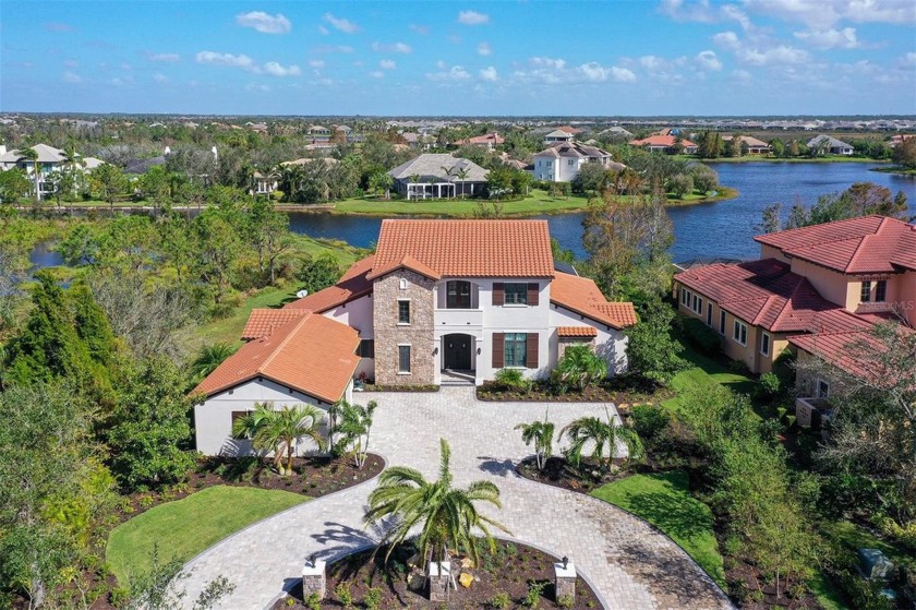 Set on a premium lakefront homesite in the Lake Club of Lakewood - Beach Home for sale in Lakewood Ranch, Florida on Beachhouse.com