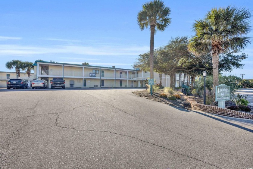 Located on the pristine sands of Litchfield Beach, this charming - Beach Condo for sale in Pawleys Island, South Carolina on Beachhouse.com