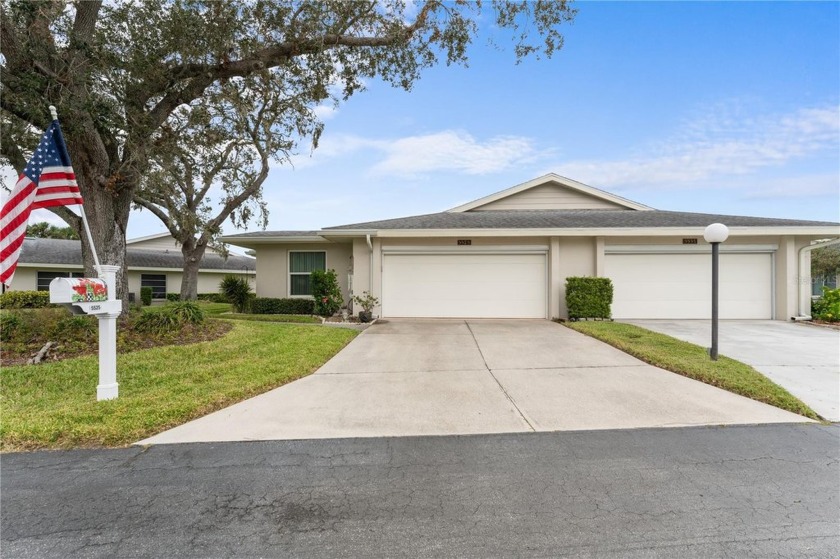 Discover this stunning 55+ lakefront home, featuring an enclosed - Beach Condo for sale in Sarasota, Florida on Beachhouse.com