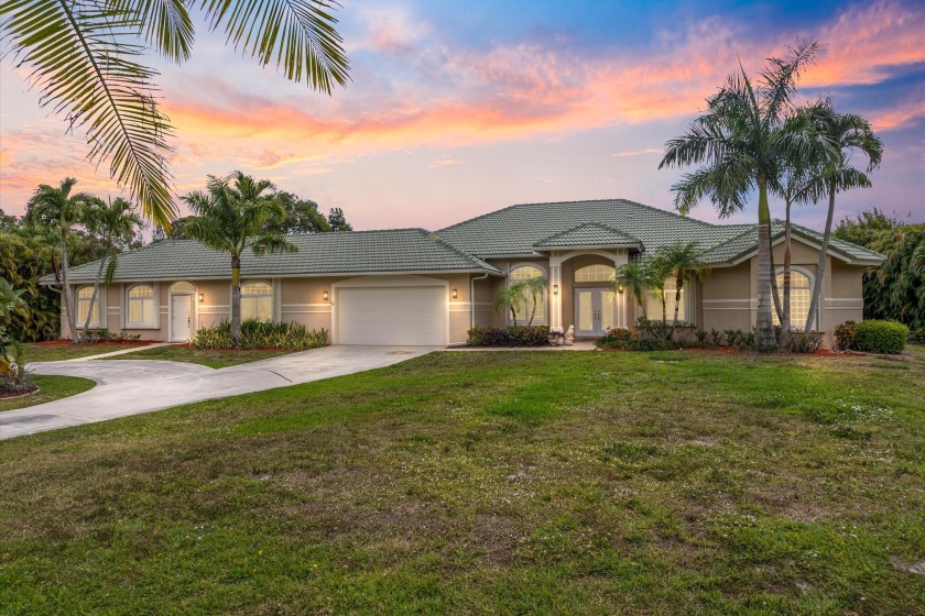 Welcome to this breathtaking estate nestled on over an acre of - Beach Home for sale in Palm Beach Gardens, Florida on Beachhouse.com