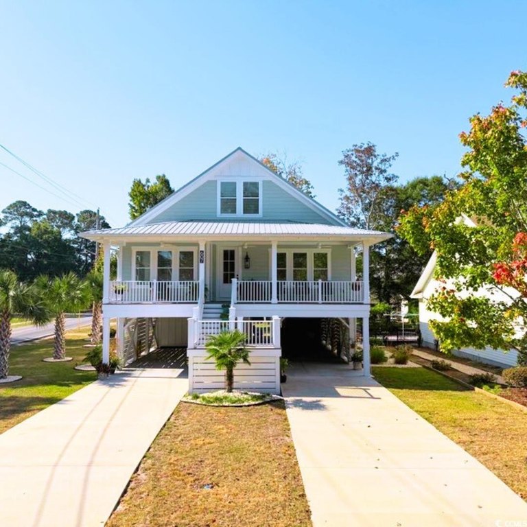 This beautiful raised beach house is currently under - Beach Home for sale in Surfside Beach, South Carolina on Beachhouse.com