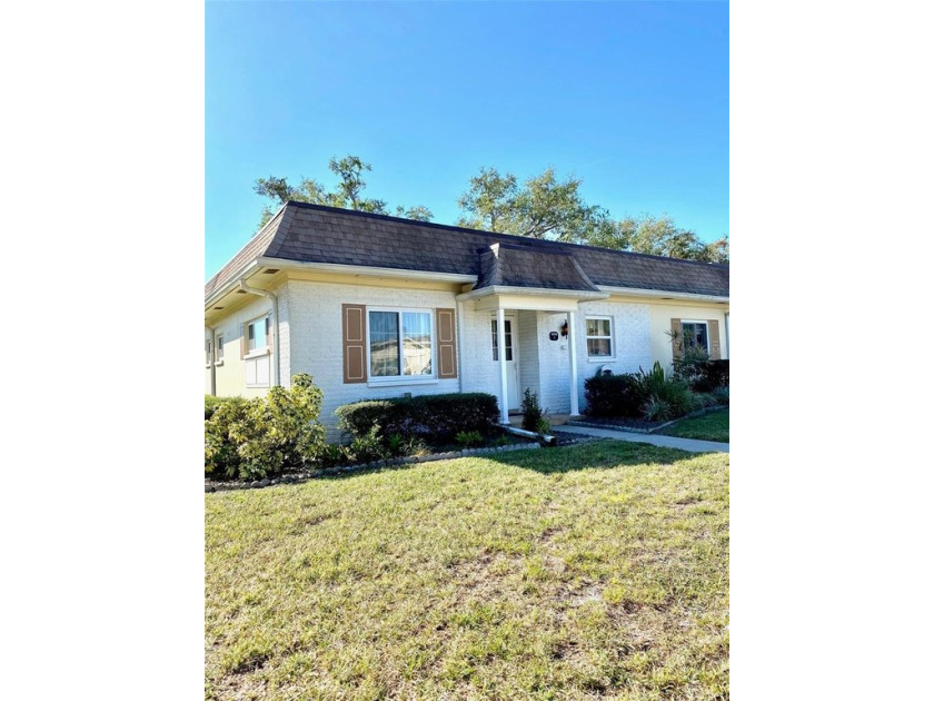 Out of the Flood Plain, this 2/2 offers such SPACIOUSNESS and - Beach Home for sale in Clearwater, Florida on Beachhouse.com