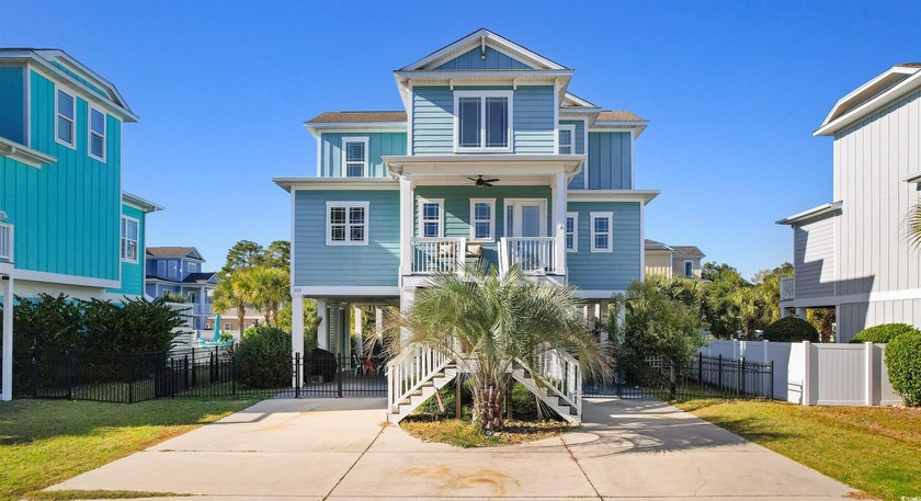 This stunning raised beach home is currently a  with a 10 STAR - Beach Home for sale in Murrells Inlet, South Carolina on Beachhouse.com