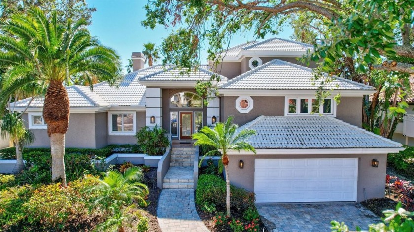 This stunning 4-bedroom home, located on the tranquil Bay Isles - Beach Home for sale in Longboat Key, Florida on Beachhouse.com