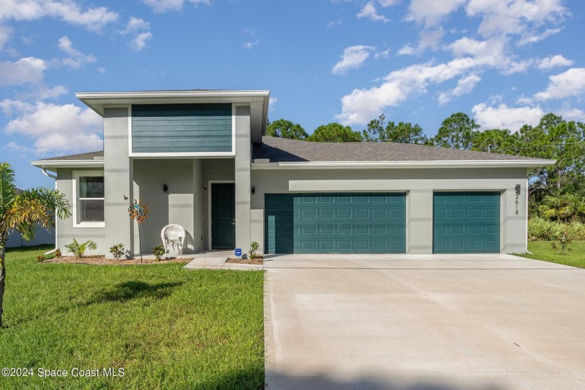 Nestled in a quiet neighborhood just outside Bayside Lakes, this - Beach Home for sale in Palm Bay, Florida on Beachhouse.com