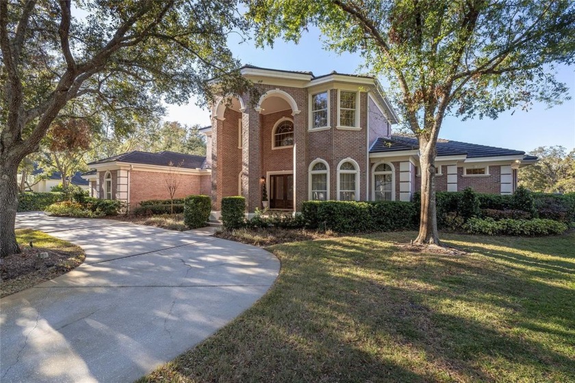 FOREVER FAIRWAY GREEN VIEWS! This timeless brick home is - Beach Home for sale in Tarpon Springs, Florida on Beachhouse.com