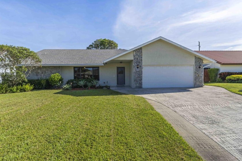 Welcome to this beautiful 3-bedroom, 2-bathroom home with a - Beach Home for sale in Lake Clarke Shores, Florida on Beachhouse.com