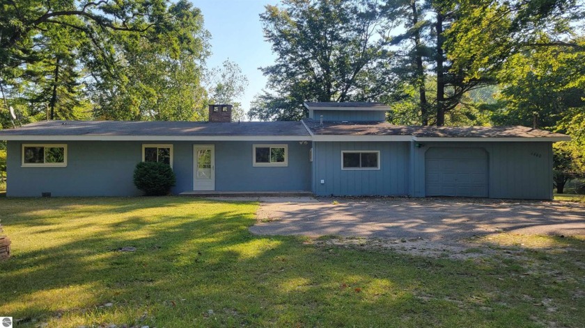 This creek-side residence offers a multifaceted living - Beach Home for sale in Oscoda, Michigan on Beachhouse.com