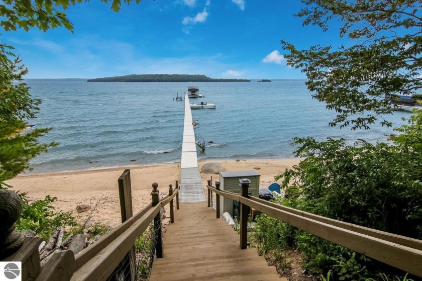 Water views & shared beach frontage highlight this newer built - Beach Home for sale in Traverse City, Michigan on Beachhouse.com