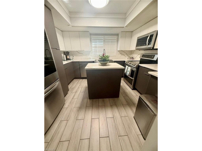 Welcome to this stunning corner unit located on the first floor - Beach Home for sale in Naples, Florida on Beachhouse.com