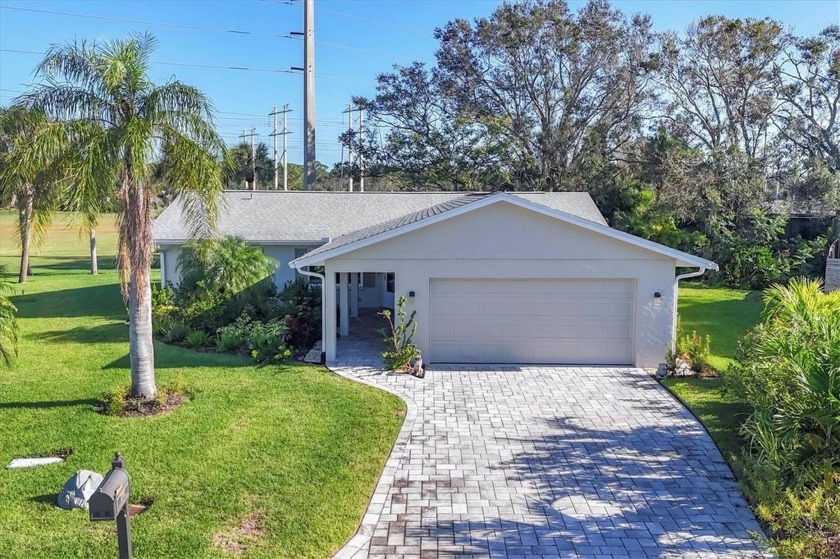 This fabulous UPDATED and RENOVATED home poised on a peaceful - Beach Home for sale in Sarasota, Florida on Beachhouse.com