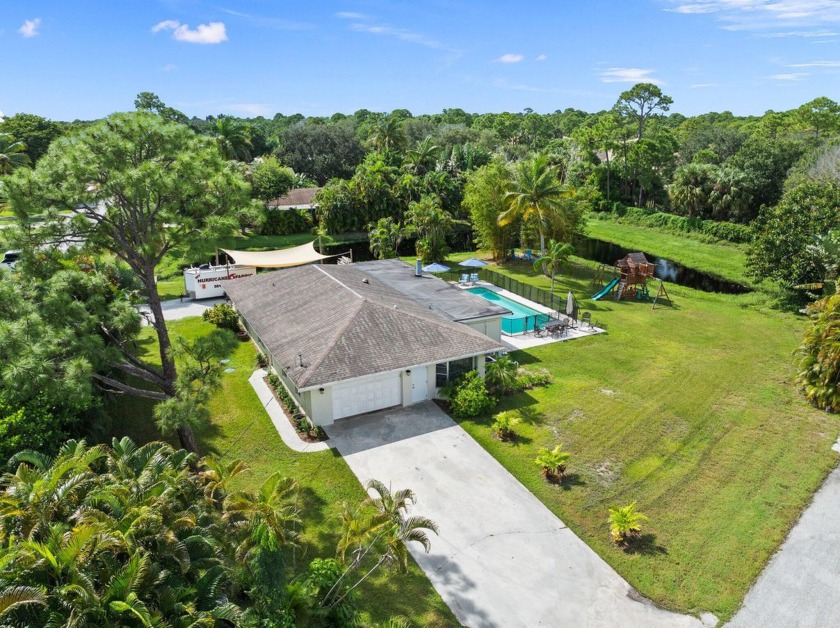 Discover the charm of Poinciana Gardens, a highly sought-after - Beach Home for sale in Hobe Sound, Florida on Beachhouse.com