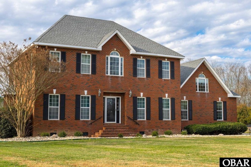 This custom-built home truly has it all, offering a perfect - Beach Home for sale in Currituck, North Carolina on Beachhouse.com