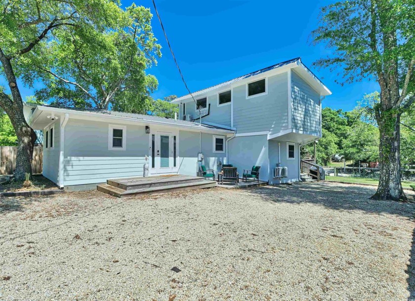 This unique property with its floating dock sits directly on a - Beach Home for sale in Murrells Inlet, South Carolina on Beachhouse.com