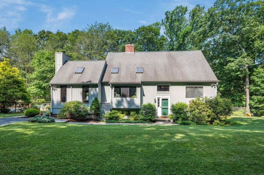 Nestled within a tranquil setting on 2.21 acres, this - Beach Home for sale in Madison, Connecticut on Beachhouse.com