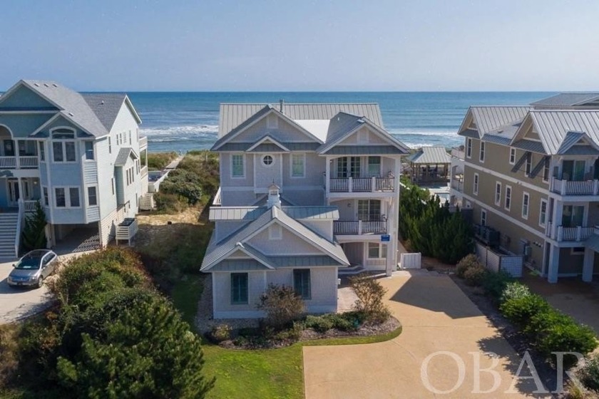 Discover the epitome of coastal living. This stunning oceanfront - Beach Home for sale in Corolla, North Carolina on Beachhouse.com