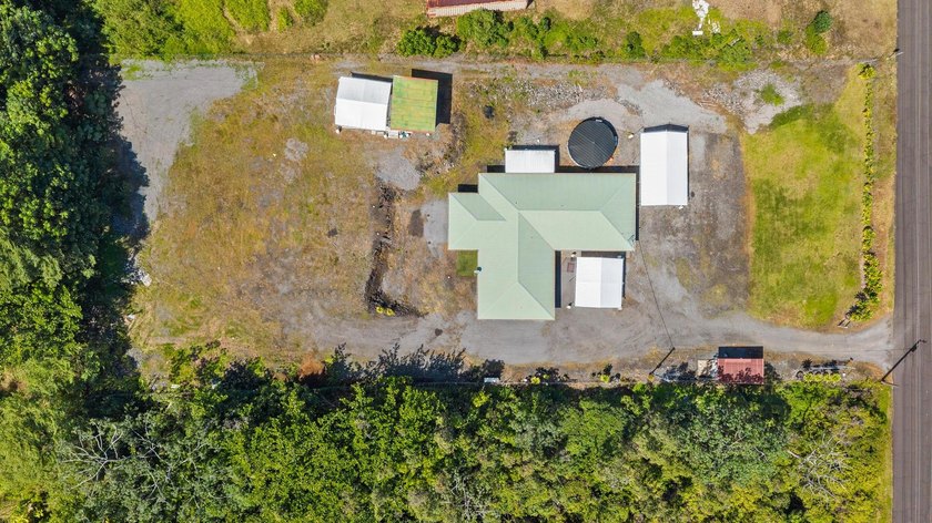 Welcome to this thoughtfully designed home, set on a fully - Beach Home for sale in Keaau, Hawaii on Beachhouse.com