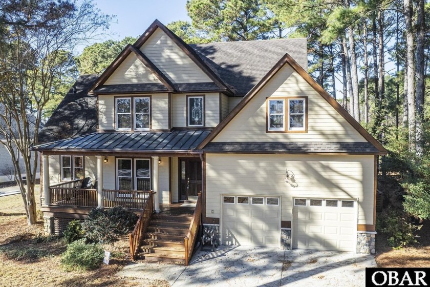 Show Stopper!   Tucked away on a gorgeous wooded lot that - Beach Home for sale in Powells Point, North Carolina on Beachhouse.com