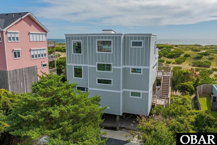 This one-of-a-kind coastal retreat offers striking architectural - Beach Home for sale in Salvo, North Carolina on Beachhouse.com