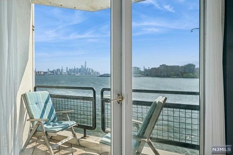 Indulge in the breathtaking views of the World Trade Center and - Beach Condo for sale in Weehawken, New Jersey on Beachhouse.com