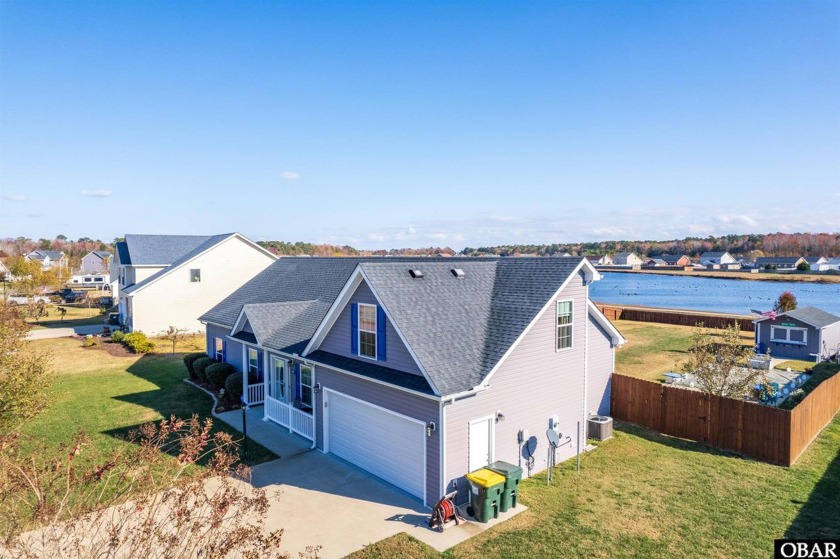 Beautiful Pool Home on a Pond Front Lot! This thoughtfully - Beach Home for sale in Currituck, North Carolina on Beachhouse.com