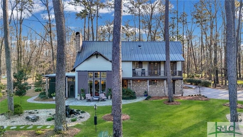 This rare 2-bedroom, 2-bath Lowcountry cottage is nestled on - Beach Home for sale in Richmond Hill, Georgia on Beachhouse.com