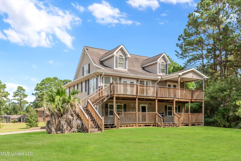 Tucked away in the serene La Ville De Courmont enclave, this - Beach Home for sale in Gautier, Mississippi on Beachhouse.com