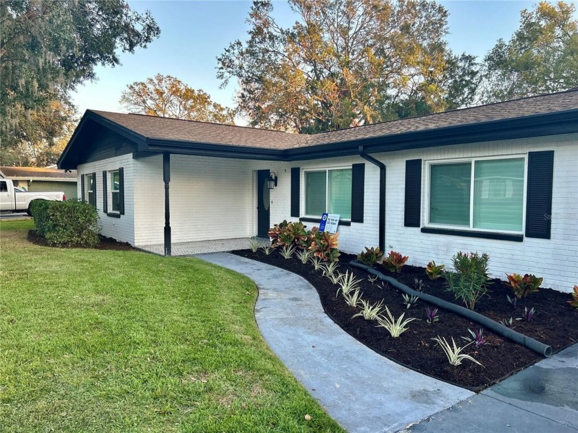 This beautifully remodeled lakefront home shows amazing! Nestled - Beach Home for sale in Tampa, Florida on Beachhouse.com