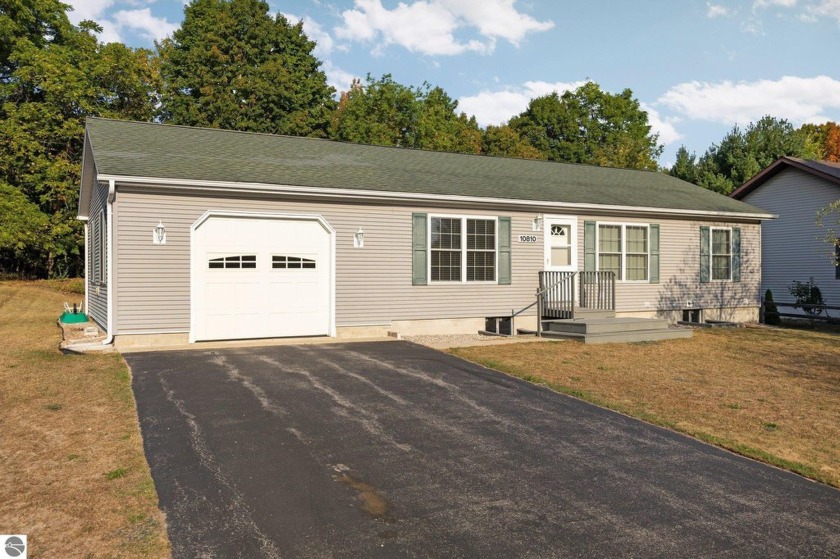 Nestled in the heart of Leelanau County, this cozy 3-bedroom - Beach Home for sale in Traverse City, Michigan on Beachhouse.com