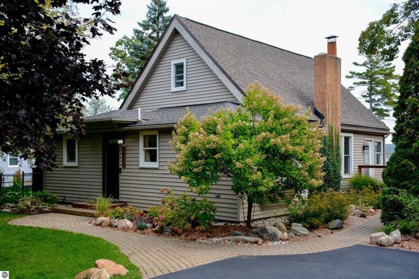 METICULOUSLY MAINTAINED HOME WITH GENEROUSLY SIZED YARD and only - Beach Home for sale in Elk Rapids, Michigan on Beachhouse.com