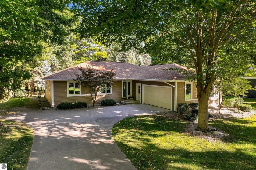 Located in a beautiful and well established neighborhood, this - Beach Home for sale in Traverse City, Michigan on Beachhouse.com