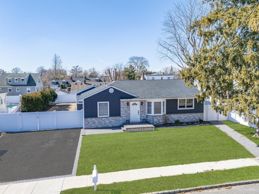 This beautifully renovated 4-bedroom, 3-bathroom home that - Beach Home for sale in West Islip, New York on Beachhouse.com