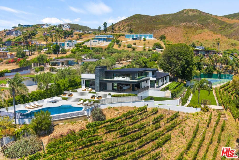 This remarkable oceanside estate, located just moments from Zuma - Beach Home for sale in Malibu, California on Beachhouse.com