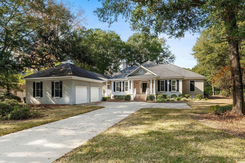 Tucked beneath a canopy of centuries-old live oaks, this - Beach Home for sale in Murrells Inlet, South Carolina on Beachhouse.com