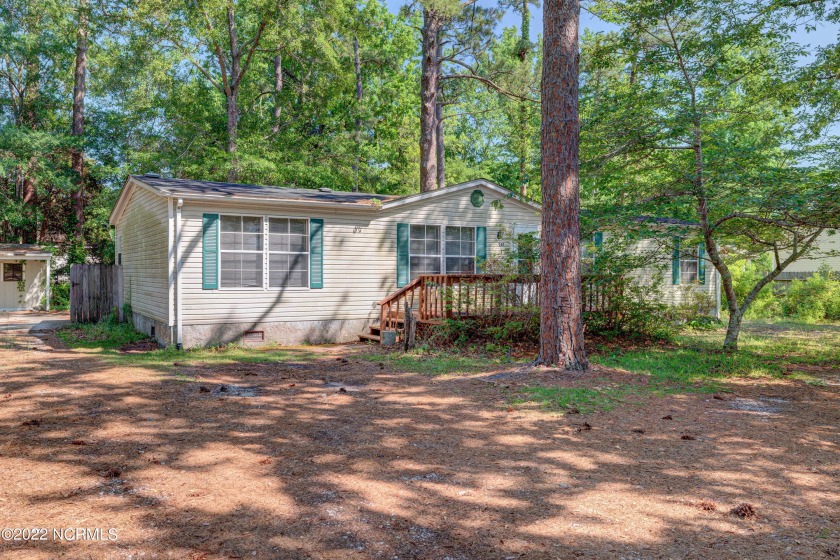 Investors take note! 4 bedroom, 2 bath manufactured home in a - Beach Home for sale in Wilmington, North Carolina on Beachhouse.com