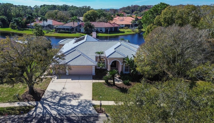 Welcome home to this exceptional ALL ONE LEVEL, POND FRONT - Beach Home for sale in Palm Harbor, Florida on Beachhouse.com