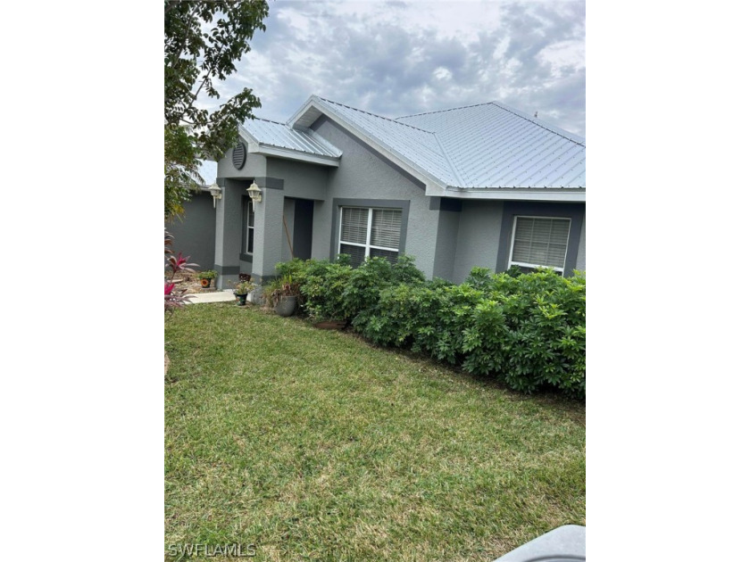 A spacious four bedroom two bath home with dining room, living - Beach Home for sale in Lehigh Acres, Florida on Beachhouse.com