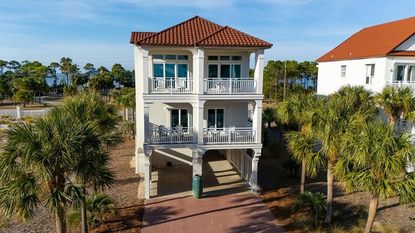 COASTAL ELEGANCE IN EXCLUSIVE SUNSET BEACH Positioned just steps - Beach Home for sale in St. George Island, Florida on Beachhouse.com