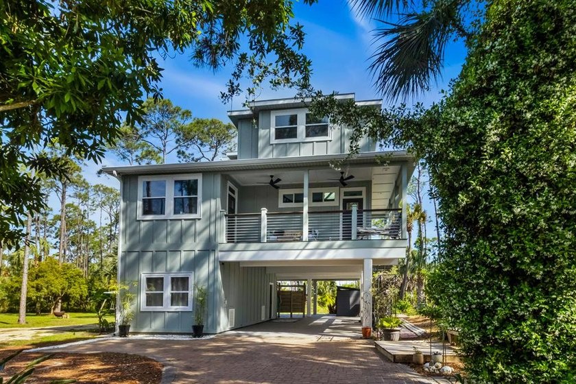 Stunning panoramic bay views from this jewel box custom home on - Beach Home for sale in St. George Island, Florida on Beachhouse.com