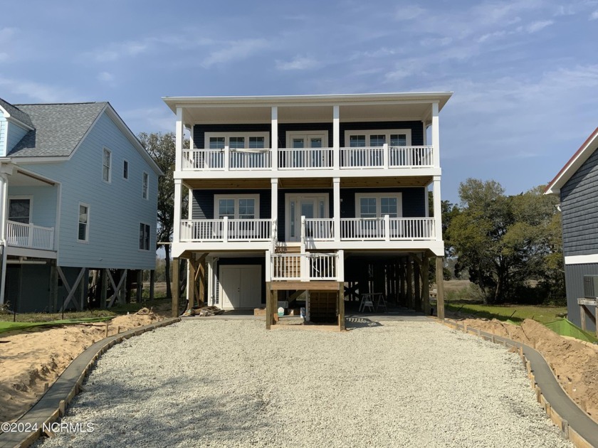 Double Up your delights with double porches, 2 laundry areas so - Beach Home for sale in Oak Island, North Carolina on Beachhouse.com