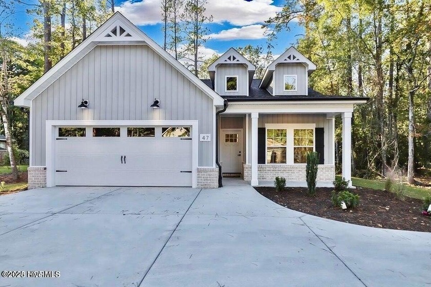 Discover a home that flawlessly blends modern sophistication - Beach Home for sale in Carolina Shores, North Carolina on Beachhouse.com