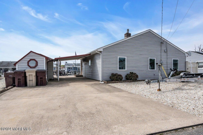 This stunning lagoon-front home offers an ideal coastal retreat - Beach Home for sale in Bayville, New Jersey on Beachhouse.com