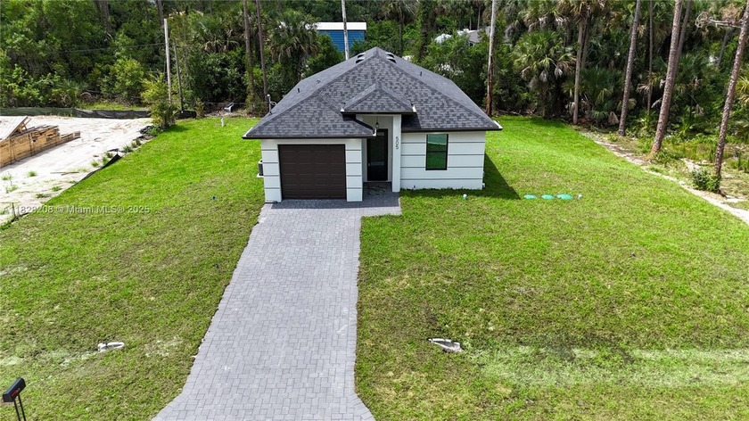 Seller will contribute to closing cost !!! This modern home - Beach Home for sale in Lehigh Acres, Florida on Beachhouse.com