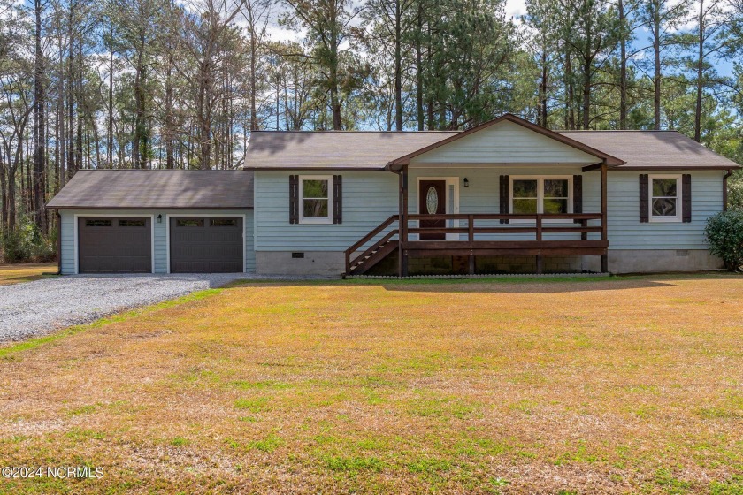 Nestled on a generous 1.15-acre lot in a serene waterfront - Beach Home for sale in Merritt, North Carolina on Beachhouse.com