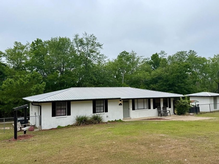 This updated 3 bedroom 2 bath home sits on 1+ acres on the edge - Beach Home for sale in Wewahitchka, Florida on Beachhouse.com