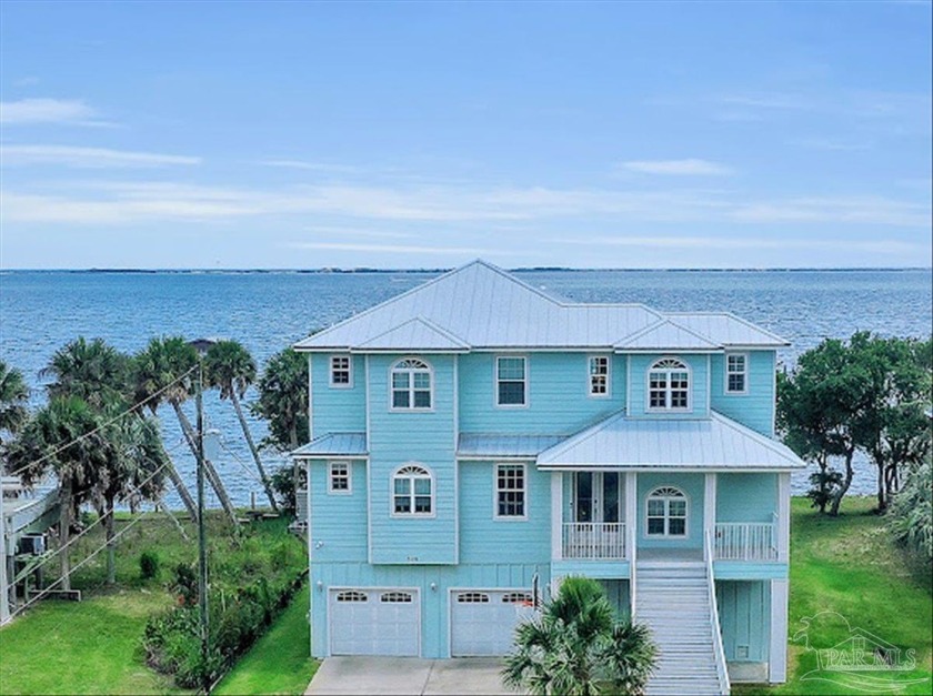 Welcome to this exquisite waterfront property nestled on the - Beach Home for sale in Gulf Breeze, Florida on Beachhouse.com
