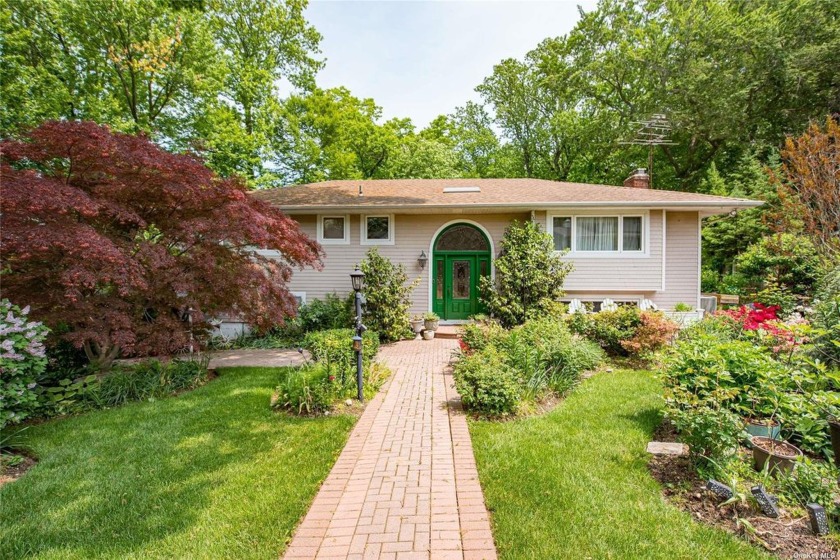 Picturesque backyard charming high ranch nestled in the heart of - Beach Home for sale in Glen Cove, New York on Beachhouse.com
