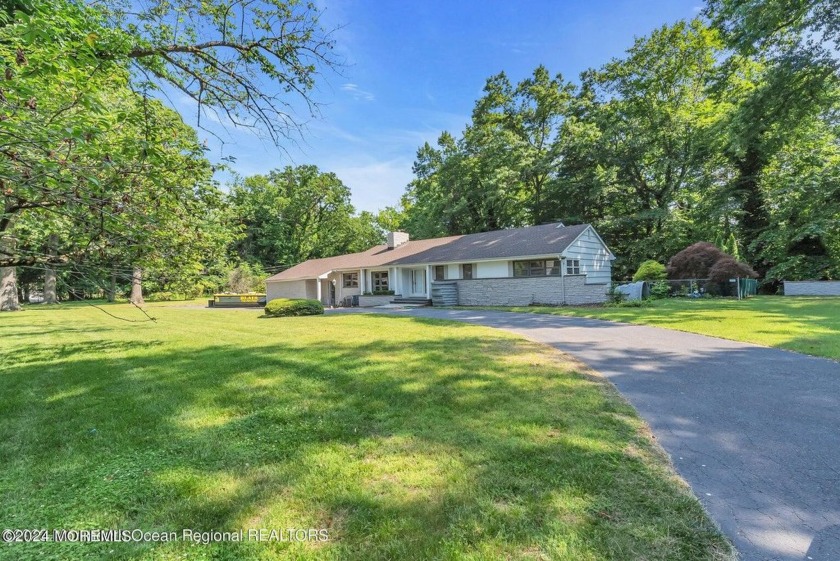 Sitting pretty on a rare 1.4-acre, waterfront lot in the - Beach Home for sale in Interlaken, New Jersey on Beachhouse.com