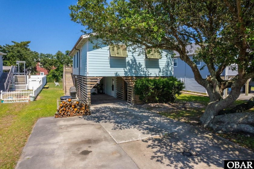 Experience eclectic charm in this updated three-bedroom home - Beach Home for sale in Kill Devil Hills, North Carolina on Beachhouse.com