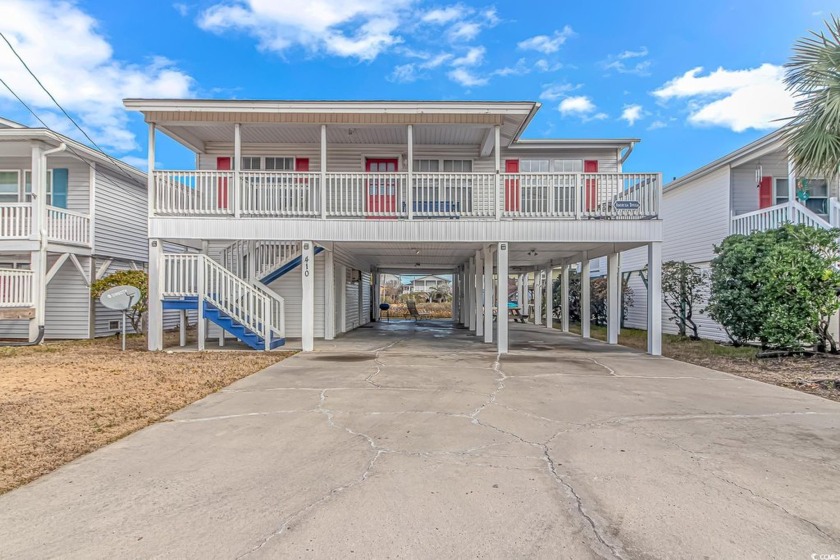 Welcome to this stunning raised beach home nestled in the - Beach Home for sale in North Myrtle Beach, South Carolina on Beachhouse.com